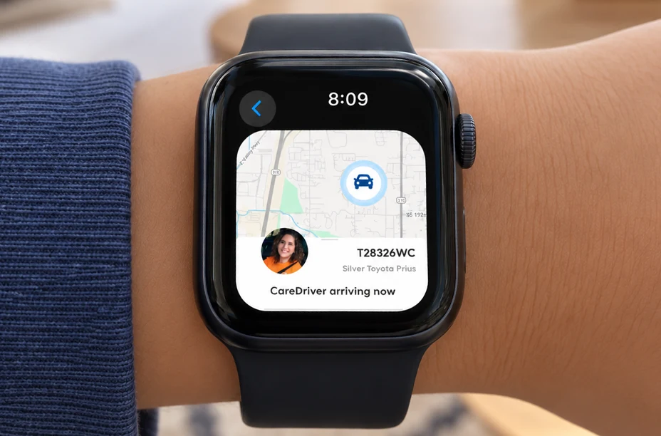 Apple Watch showing Track My Ride with a live map, vehicle T28326WC, and CareDriver arriving now