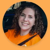 Portrait of a smiling CareDriver in an orange shirt