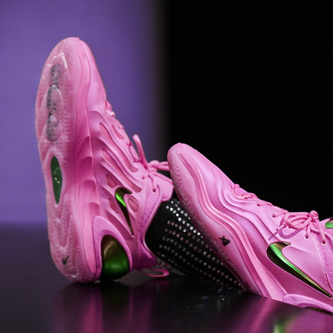 Nike A'Two A'Pink Shoe – creative product shot showing pink basketball shoe with green Swoosh and outsole detail