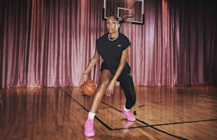 A'ja Wilson wearing the Nike A'Two basketball shoe in pink on court – signature sneaker with pearl design and Zoom Air cushioning