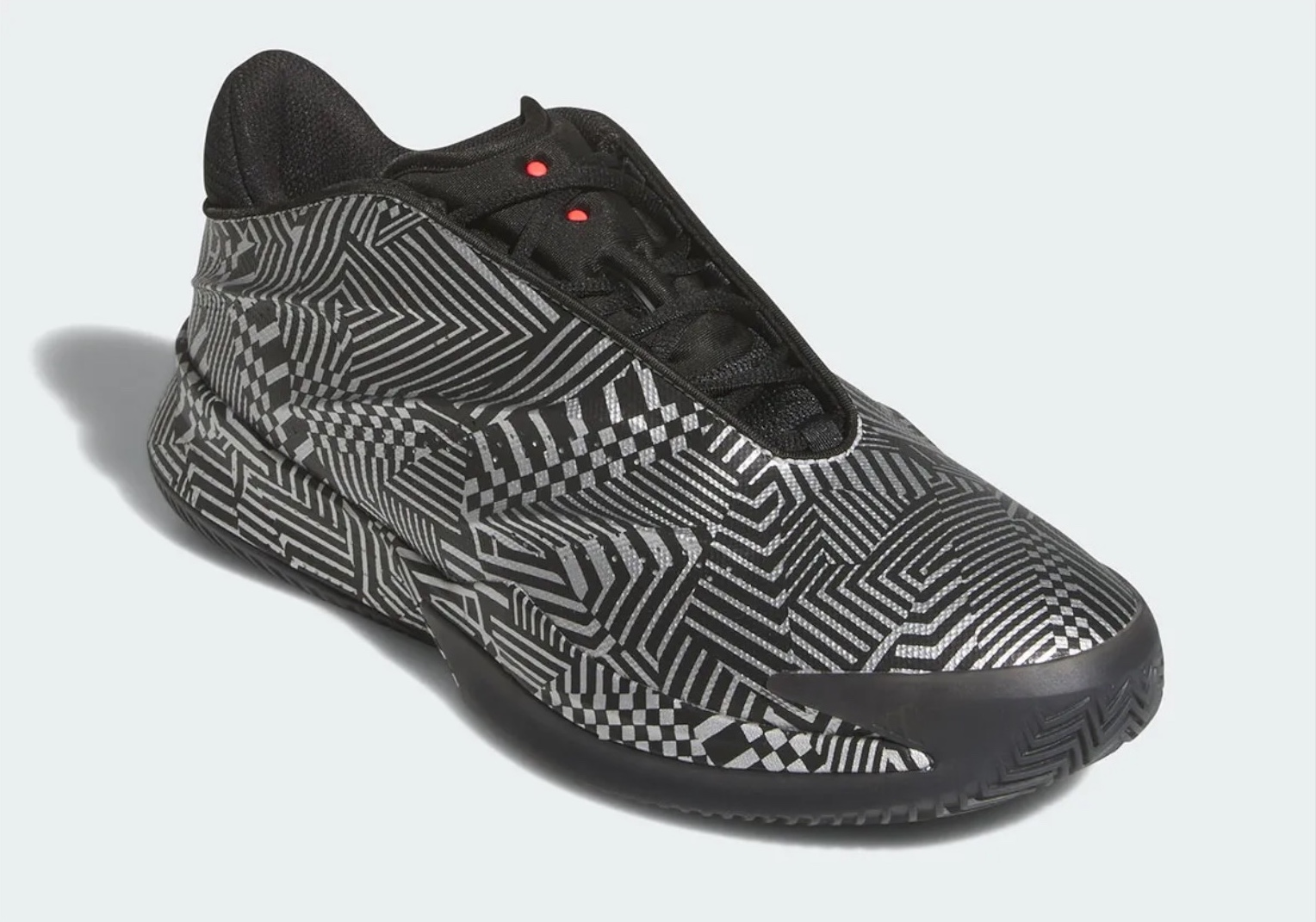 The adidas Crazy Energy+ showcases an innovative reflective geometric design featuring interlocking patterns and optical illusions in black and metallic silver. The shoe features a low-cut collar with red lace eyelets and combines sleek performance technology with eye-catching retro-futuristic aesthetics, ideal for modern basketball players seeking style and functionality.