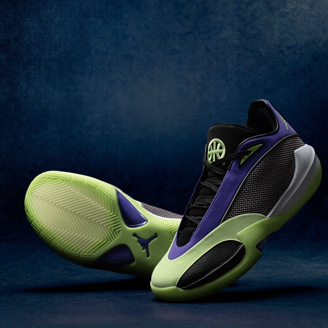 Two Jordan Triangle Q54 basketball shoes displayed against a dark blue background. The front shoe is tilted to reveal the full volt green outsole, showing a herringbone-style chevron traction pattern, a purple Triangle accent in the midfoot, and a deep purple Jumpman logo at the heel. The rear shoe shows the lateral profile with a black mesh upper, deep purple midfoot overlay, volt green midsole with a sculpted cutout, and a volt green embroidered Quai54 basketball logo on the tongue. A light grey heel counter is visible on the outer edge.