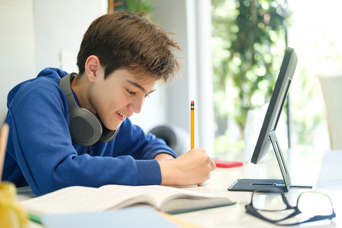 Secondary-boy-student-engaged-in-online-learning