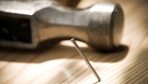 Hammer with nail