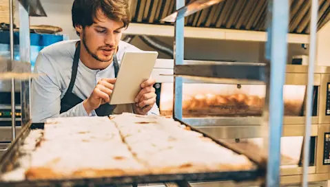 bakery worker with tablet