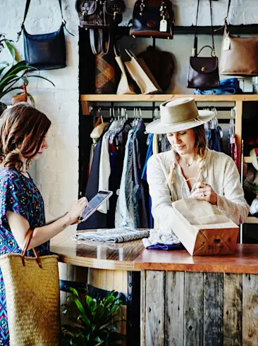 Two women in apparel retail store 