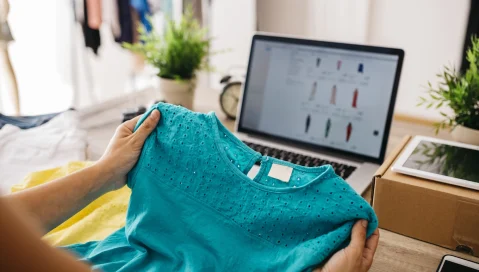 Tshirt being examined in clothing store.