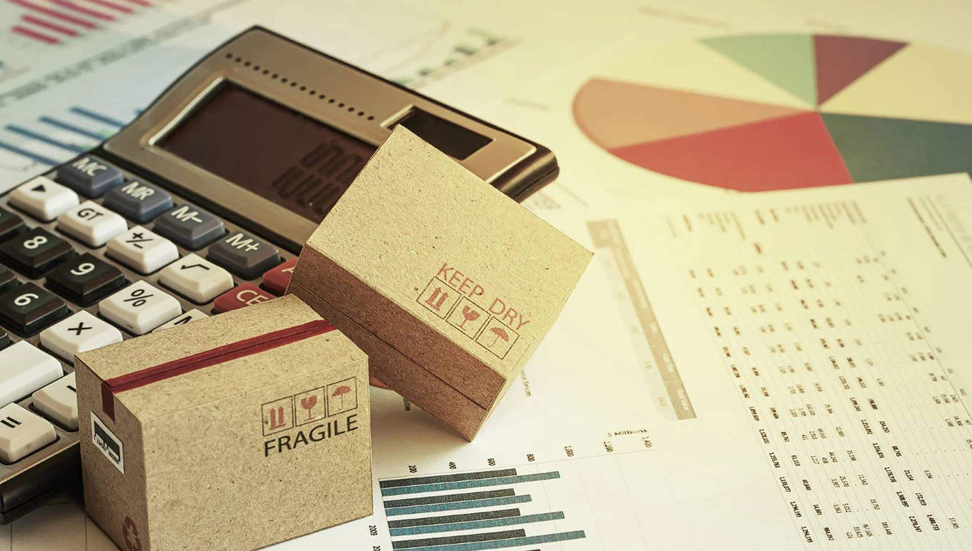 calculator, data reports and miniature cardboard boxes