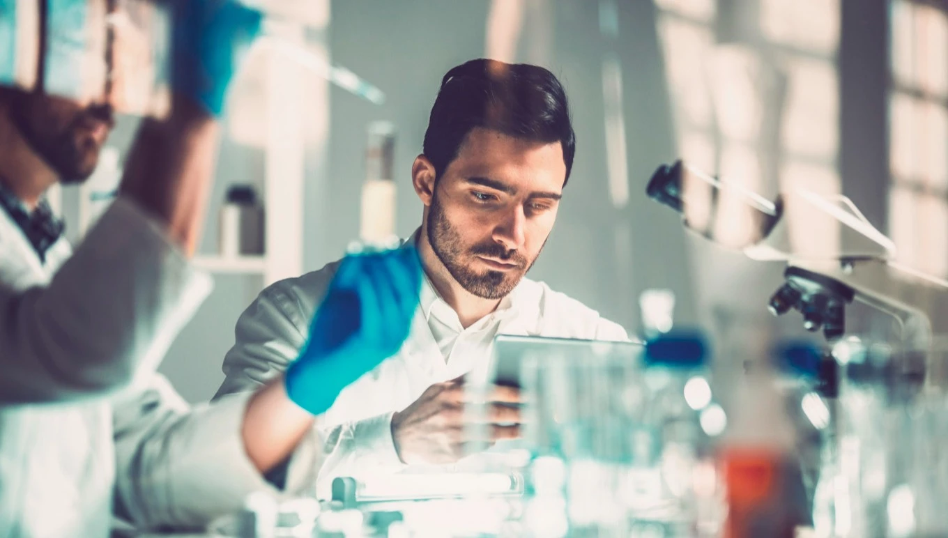 Young man in science lab