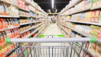 grocery aisle blurred empty shopping cart