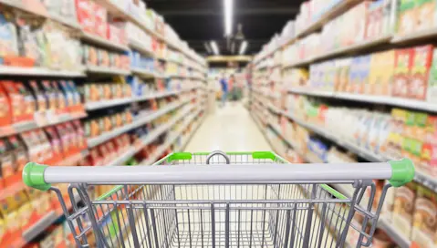 grocery aisle blurred empty shopping cart
