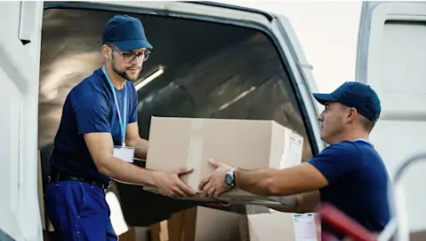 movers lifting a box