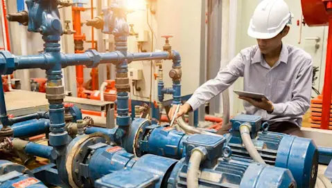 Man inspecting machine