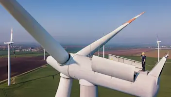 Man repairing wind turbine