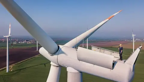 Man repairing wind turbine