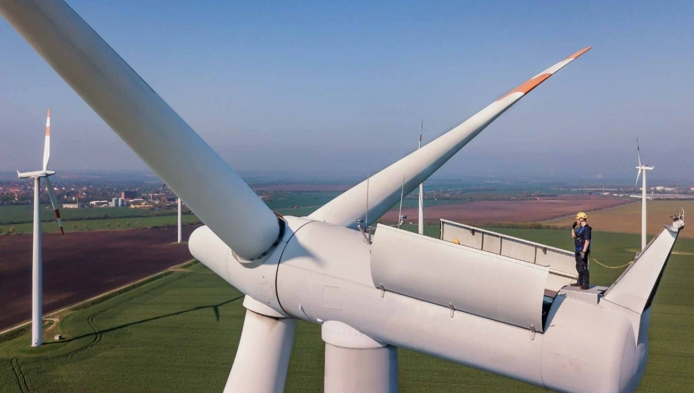Man repairing wind turbine