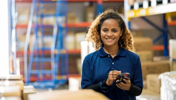 Woman taking inventory in warehouse