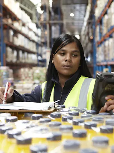 Person in warehouse counting inventory