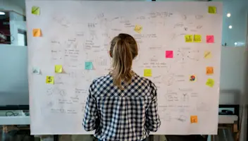 Woman looking at whiteboard