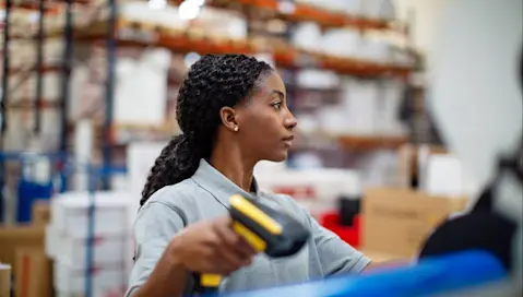 Woman with barcode scanner