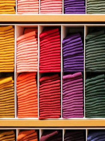 Stacks of colorful socks in retail display