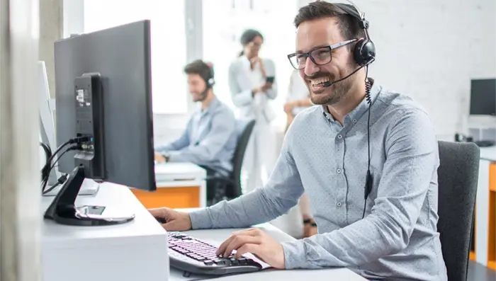 Man smiling - customer support operator.