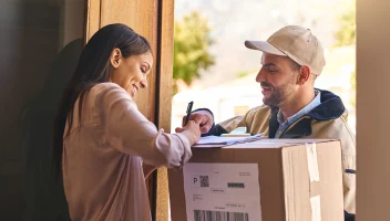 woman signing for a package