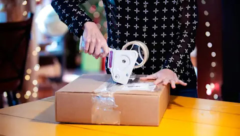 tape gun on package