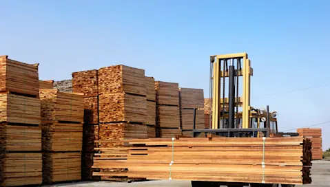 Forklift operating in lumber yard