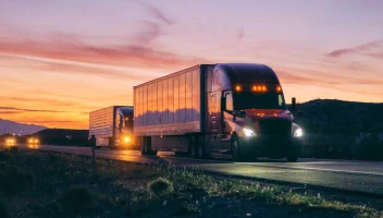 semitrucks at sunset