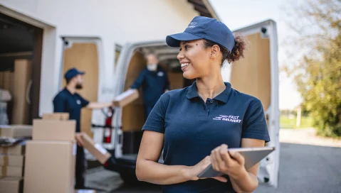 Delivery team with packages from delivery van