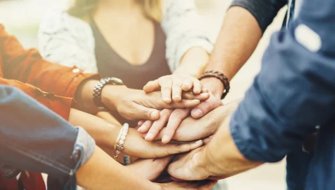 Casual group closeup hands.