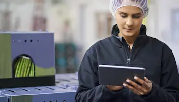 woman with tablet in food warehouse