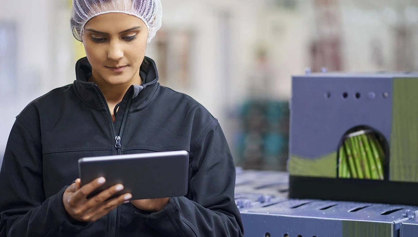 woman with tablet in food warehouse
