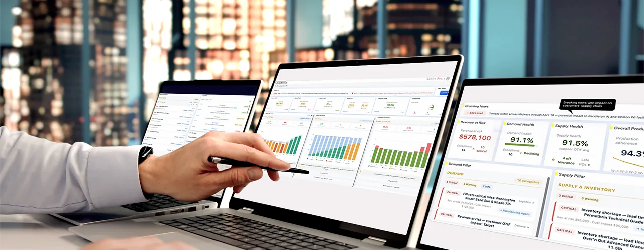 Man pointing at charts at laptop