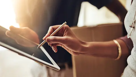 Person signing for a delivery