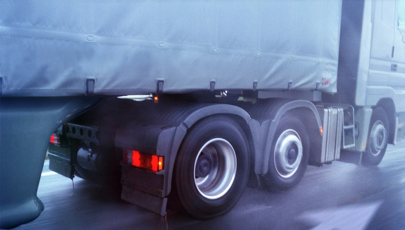 Truck driving on highway in the rain