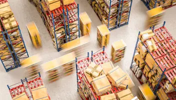 Warehouse workers in action moving boxes