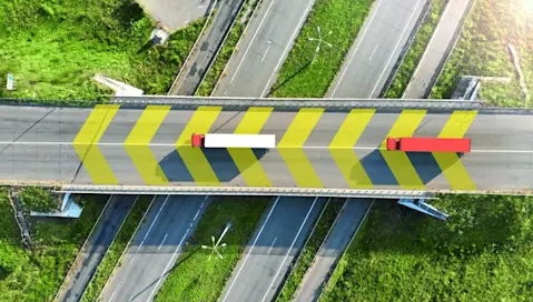 Trucks on highway bridge overpass