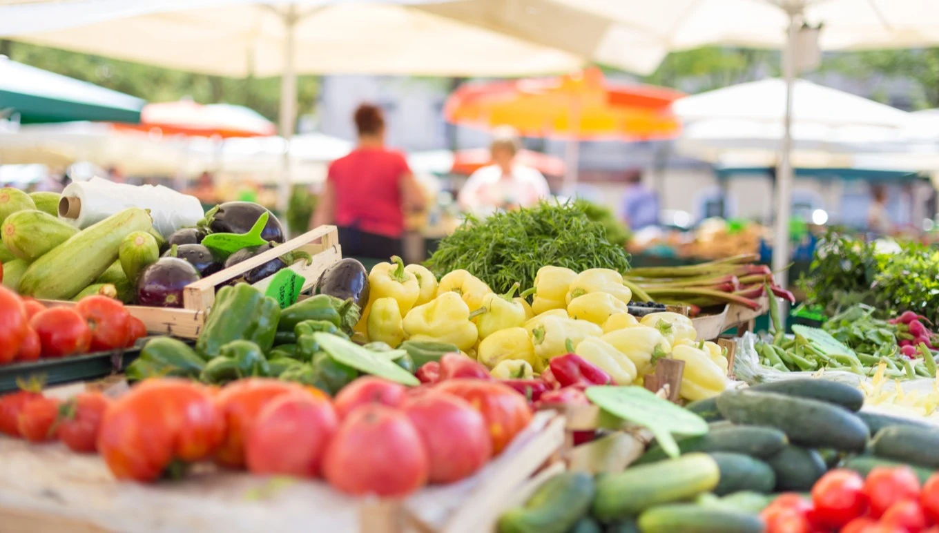 Fresh fruits and vegetables at an outdoor market.
