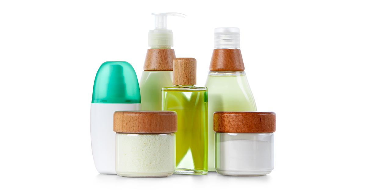 Assorted glass bottles containing body lotion.
