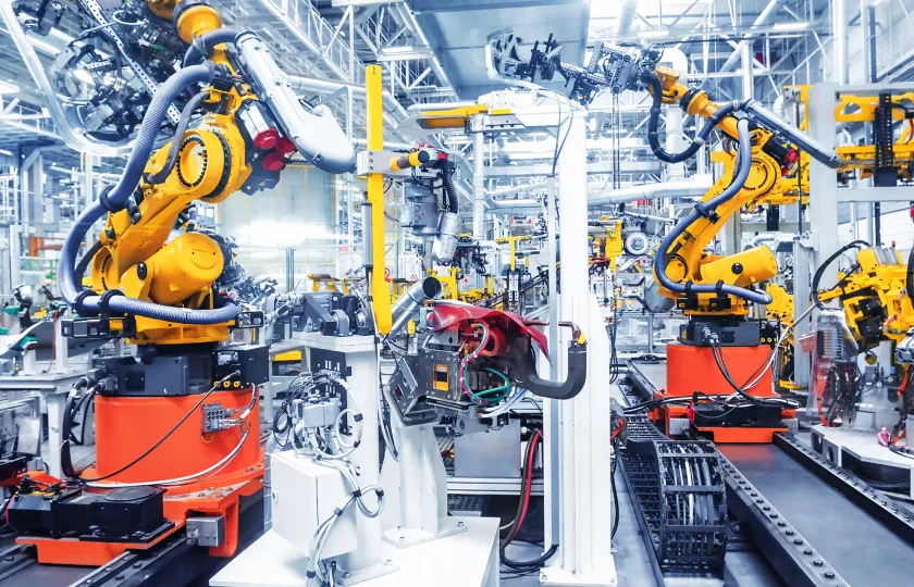 Robotic arms operating on an automotive production line