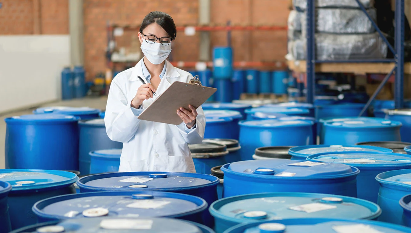 Worker using a clipboard in warehouse