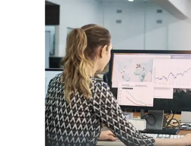 Woman on computer looking at data.