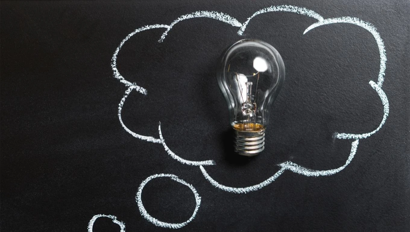 A lightbulb in a thought bubble representing a new idea.