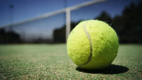 Tennis ball on tennis court