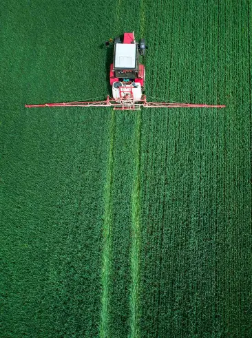 Tractor in green field