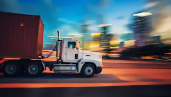 A truck follows a fully optimized route enabled by strategic route planning software.