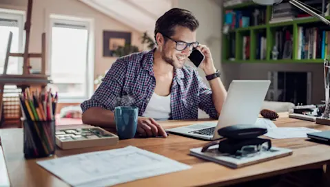 Man working at desk from home office