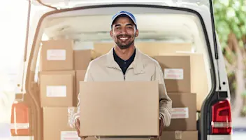 Man with delivery van full of boxes